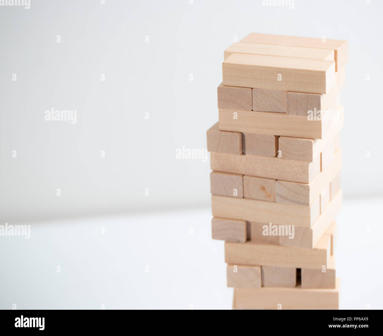 jenga tower on the white background on the table Stock Photo