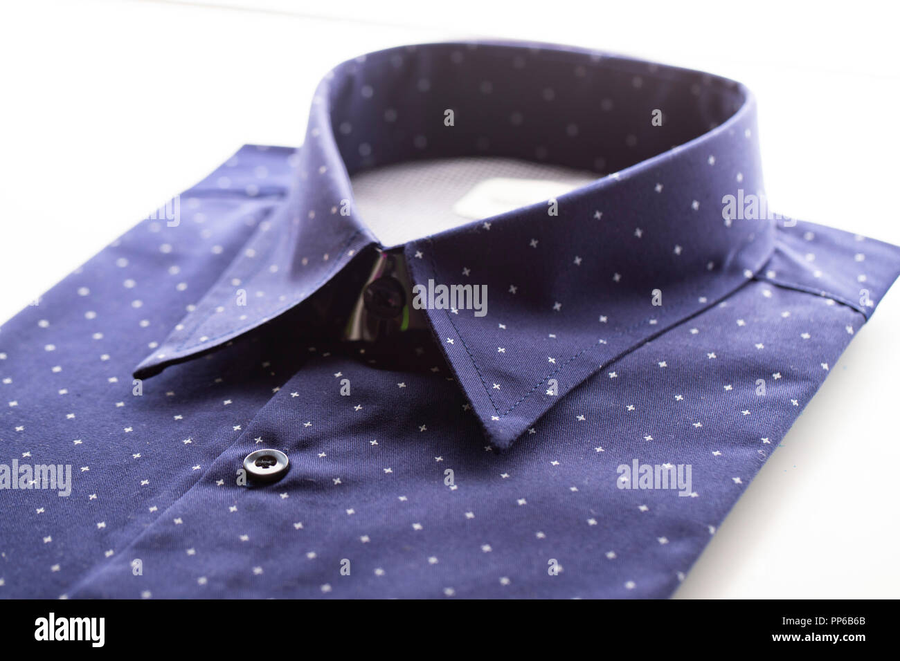 dark blue shirt on the white background Stock Photo - Alamy