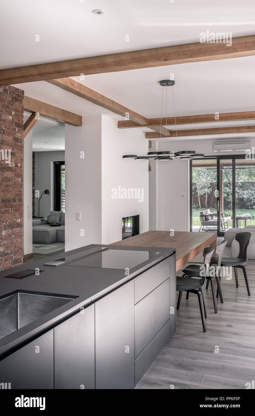 Table Brick Kitchen Island Design trendy modern interior with white and brick walls and a ceiling with wooden beams there is a kitchen island table with chairs chandelier sofas fi