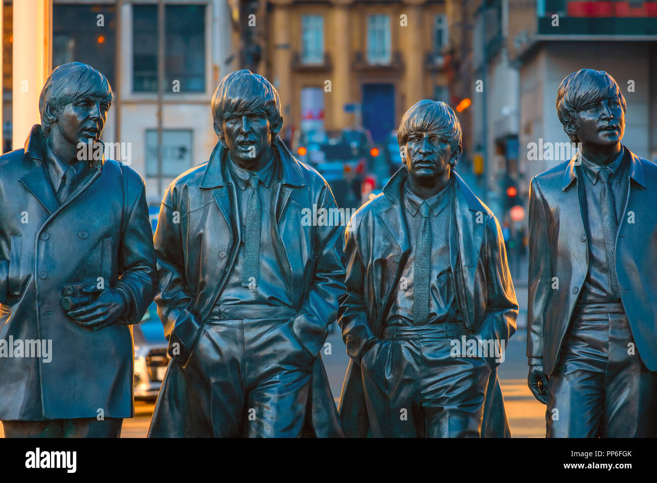 Liverpool, UK - May 17 2018: Bronze statue of the  Beatles stands at the Pier Head on the side of River Mersey, sculpted by Andrew Edwards and erected Stock Photo