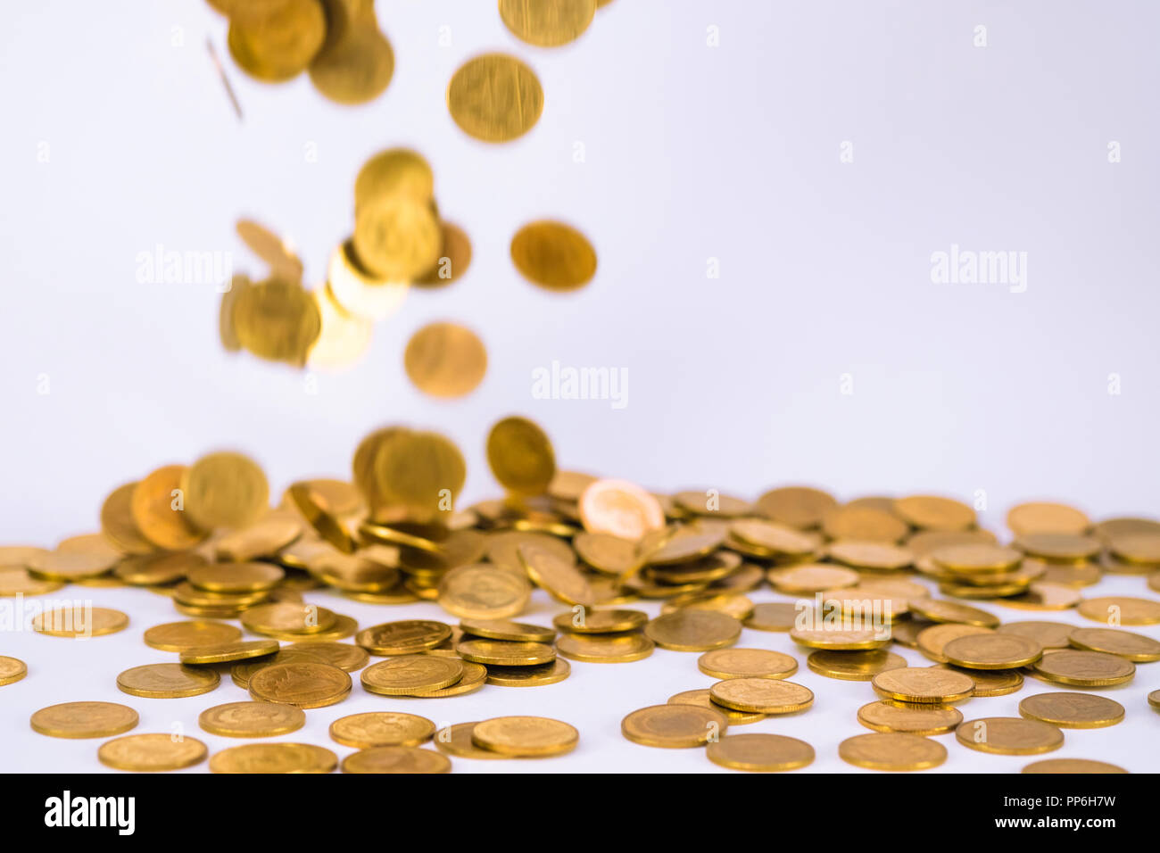 Movement of falling gold coin, flying coin, rain money with soft shadow on  white background, business and financial wealth and take profit concept ide  Stock Photo - Alamy