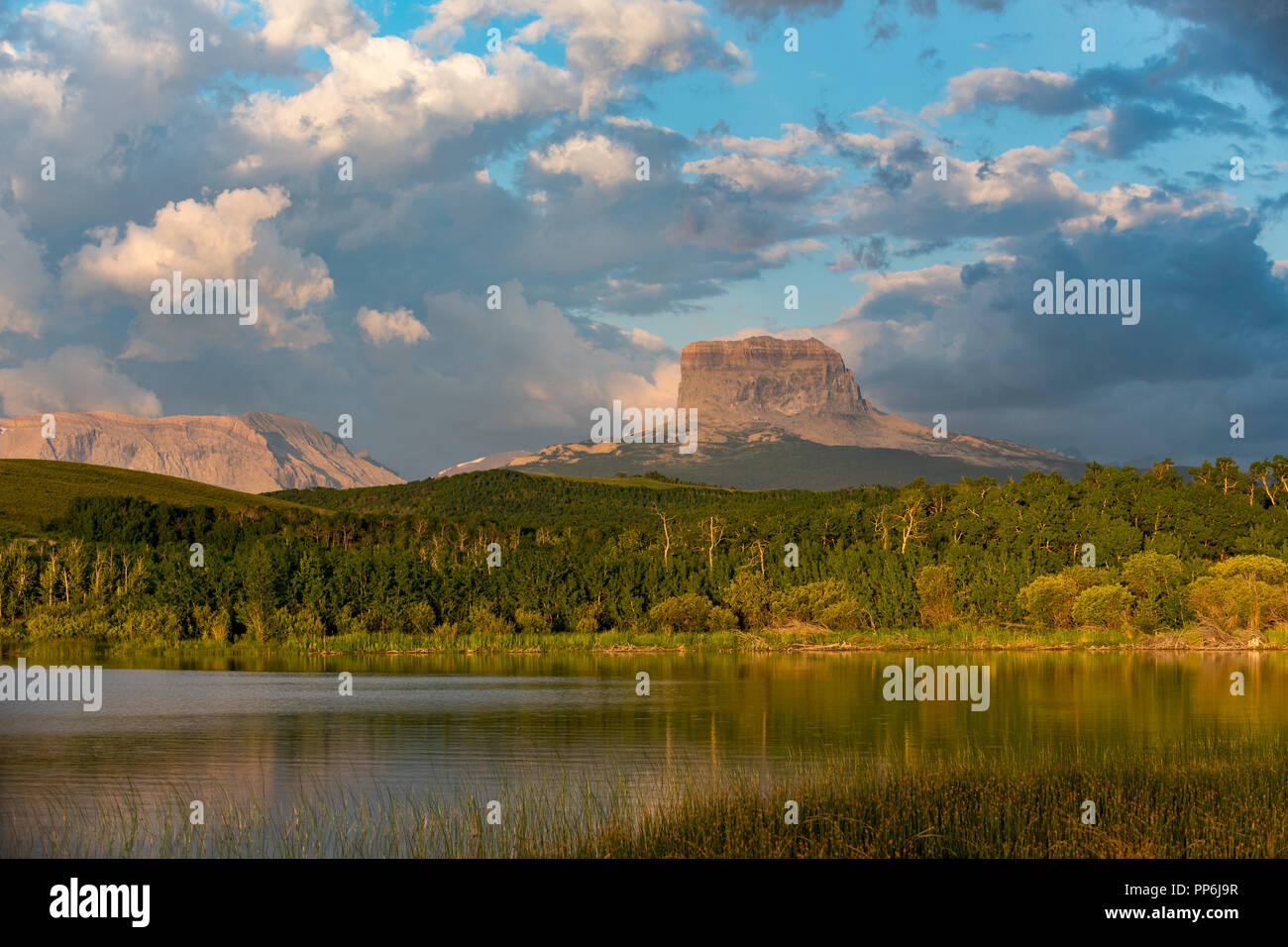 Old Chief Mountain overlooking Police Outpost Lake in South West Alberta near Waterton National Park Stock Photo
