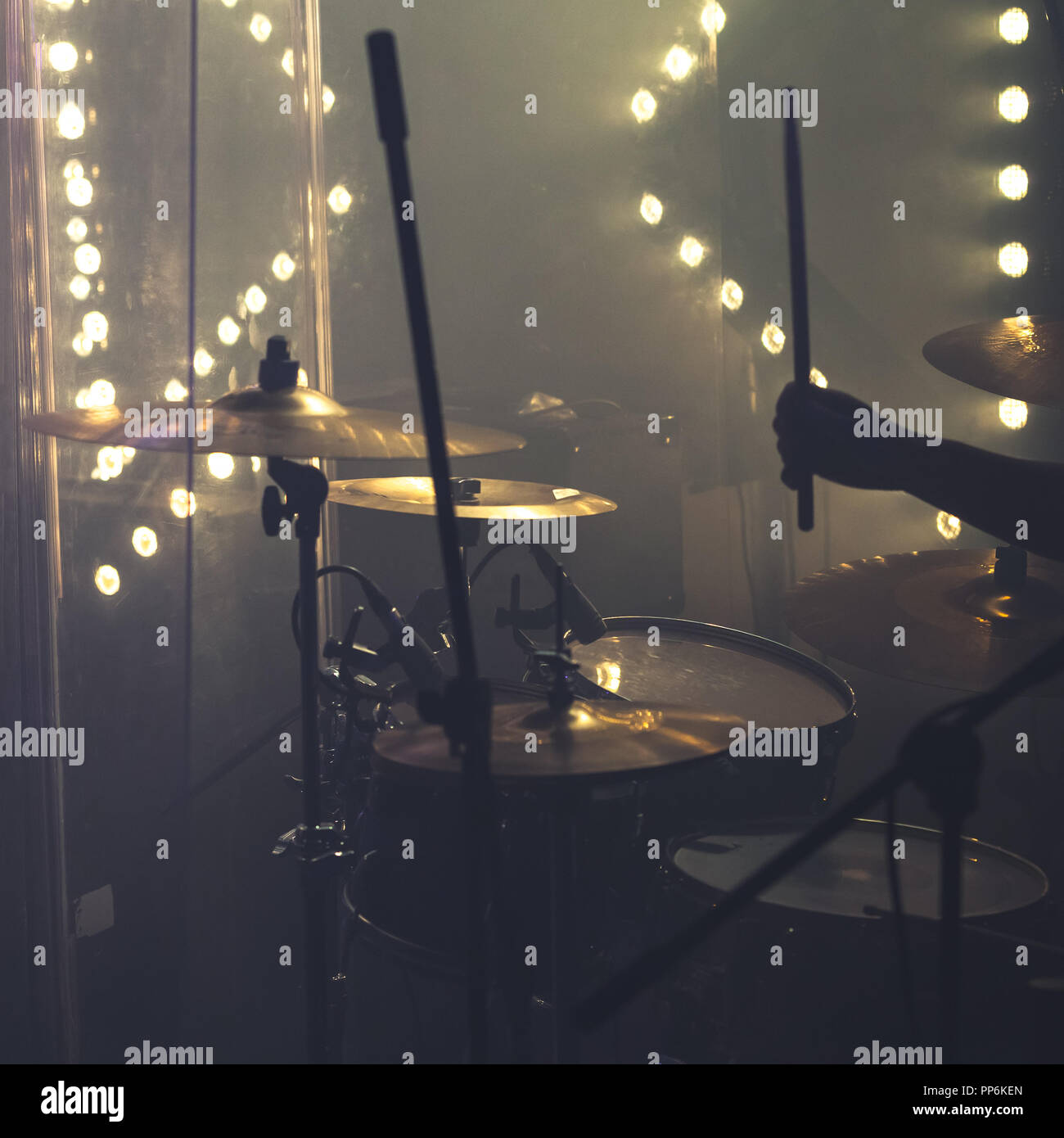 Live rock music background, drum set with cymbals and drummer hand Stock Photo