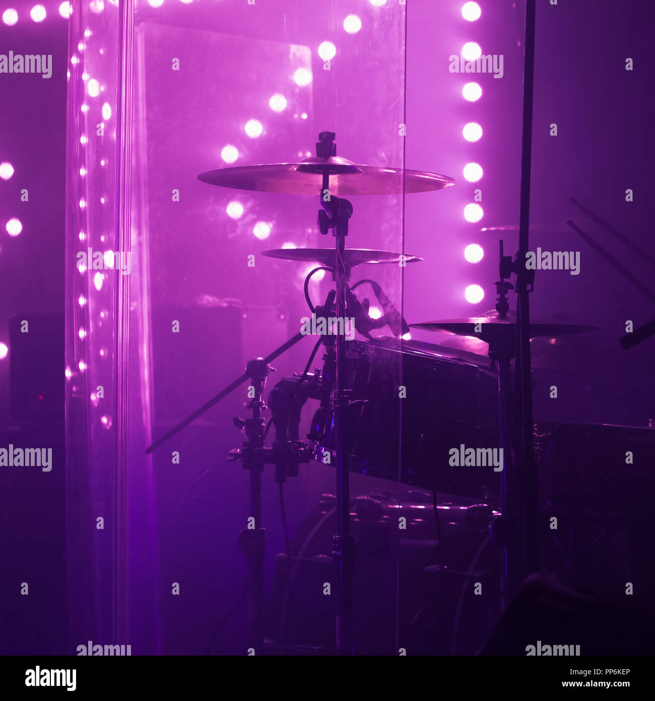 Live music photo background, rock drum set with cymbals in bright stage lights. Closeup photo, soft selective focus Stock Photo