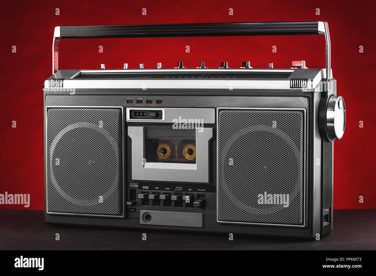 1980s Silver retro radio boom box on red background. Stock Photo