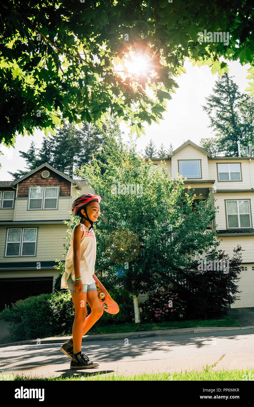 Girl walking on sidewalk hi-res stock photography and images - Alamy