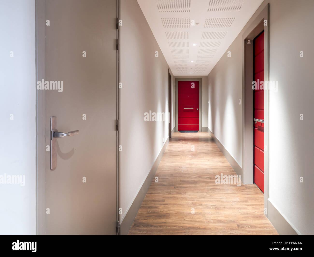 Front door of several flats in an apartment building Stock Photo