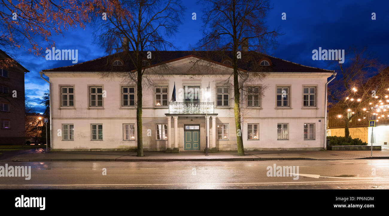 Kuressaare, Estonia. Old Administrative Building In Tallinn Street In Evening Night Illuminations. Stock Photo