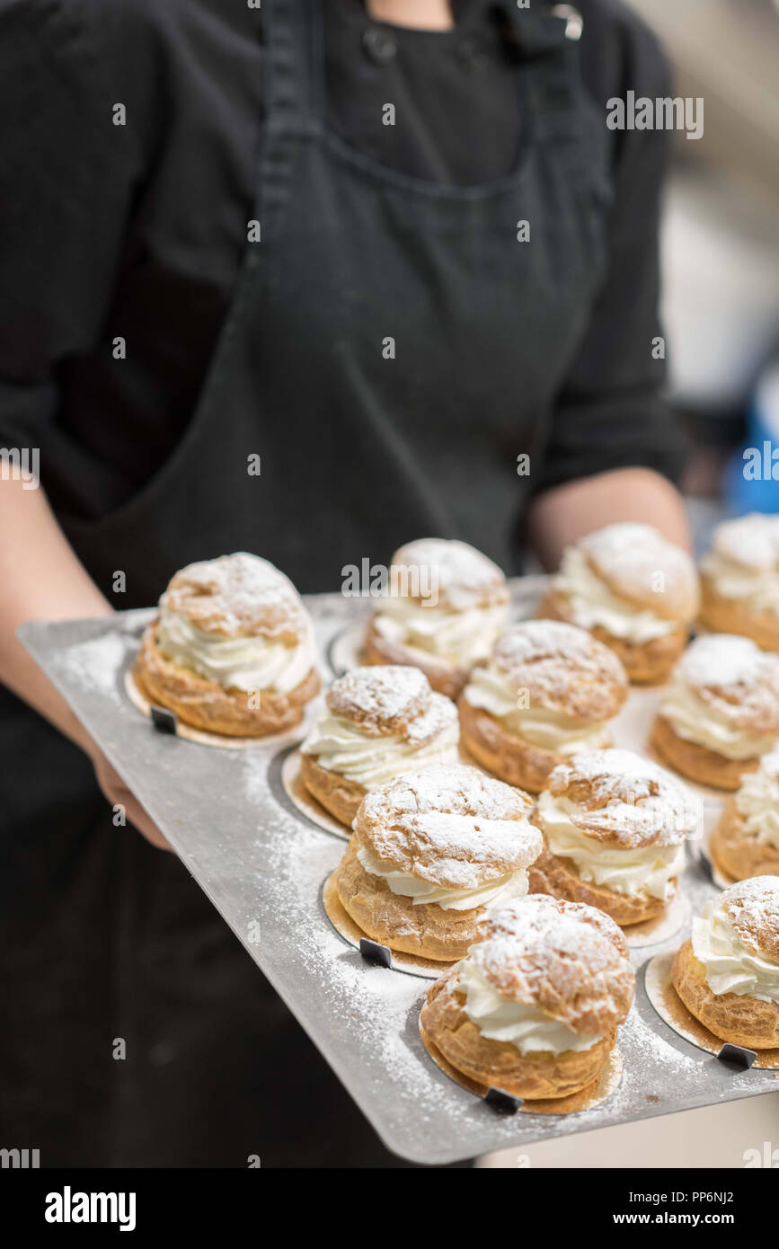 Cream puff making in a cake shop Stock Photo