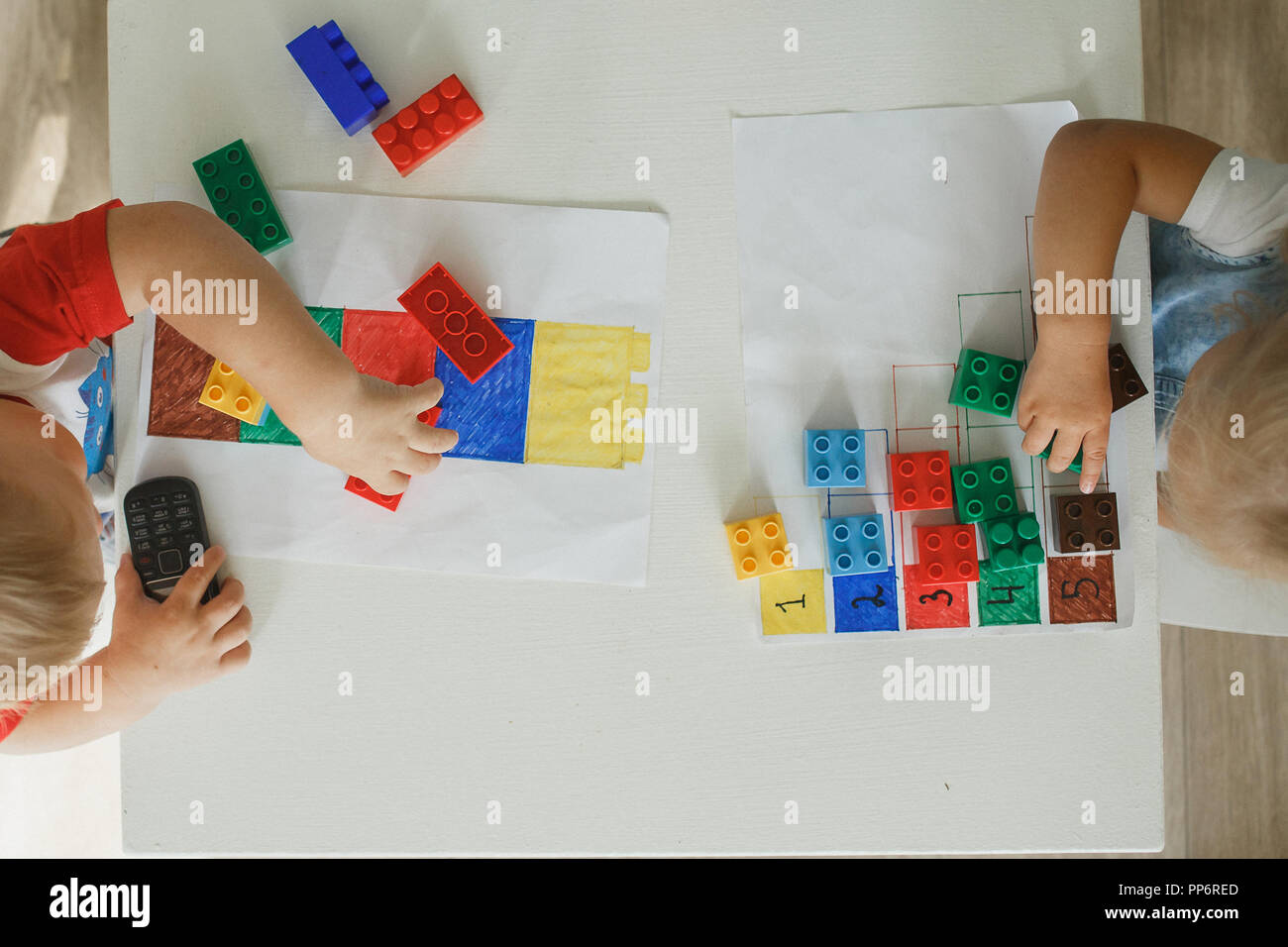 Child playing with blocks educational kit in the kindergarten Stock Photo