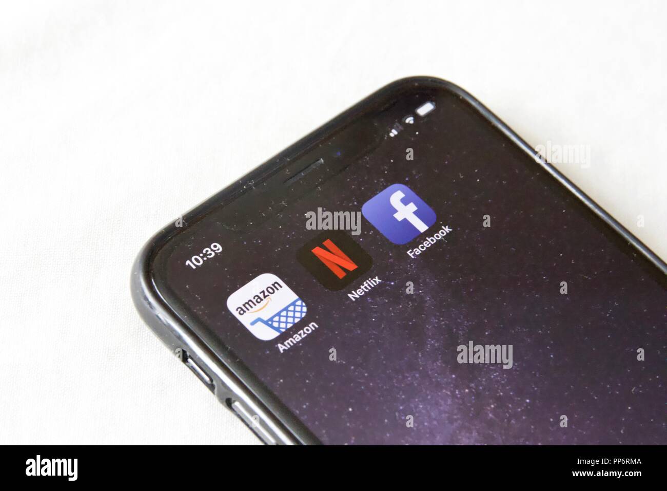A concept of Technology: Facebook, Netflix, Amazon apps on an iPhone X Stock Photo