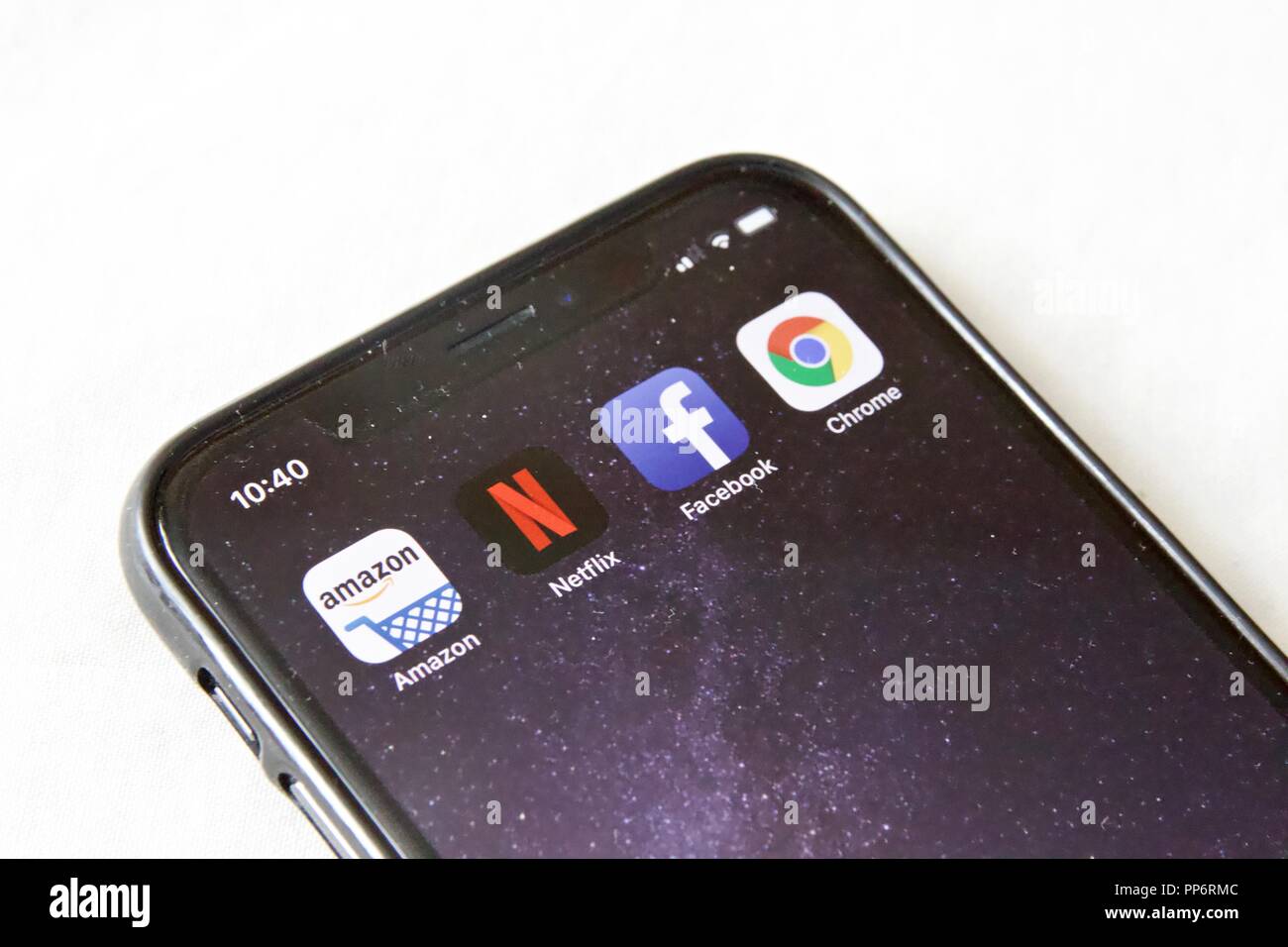 FAANG concept (Facebook,Apple,Amazon,Netflix,Google). Amazon,Chrome, Facebook, Netflix apps on an iPhone X Stock Photo