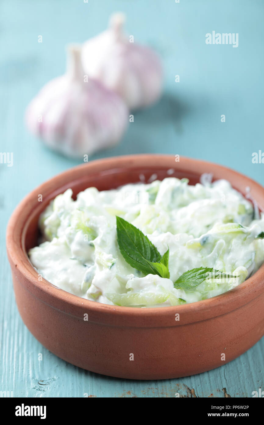 Tzatziki with basil leaf in a bowl Stock Photo