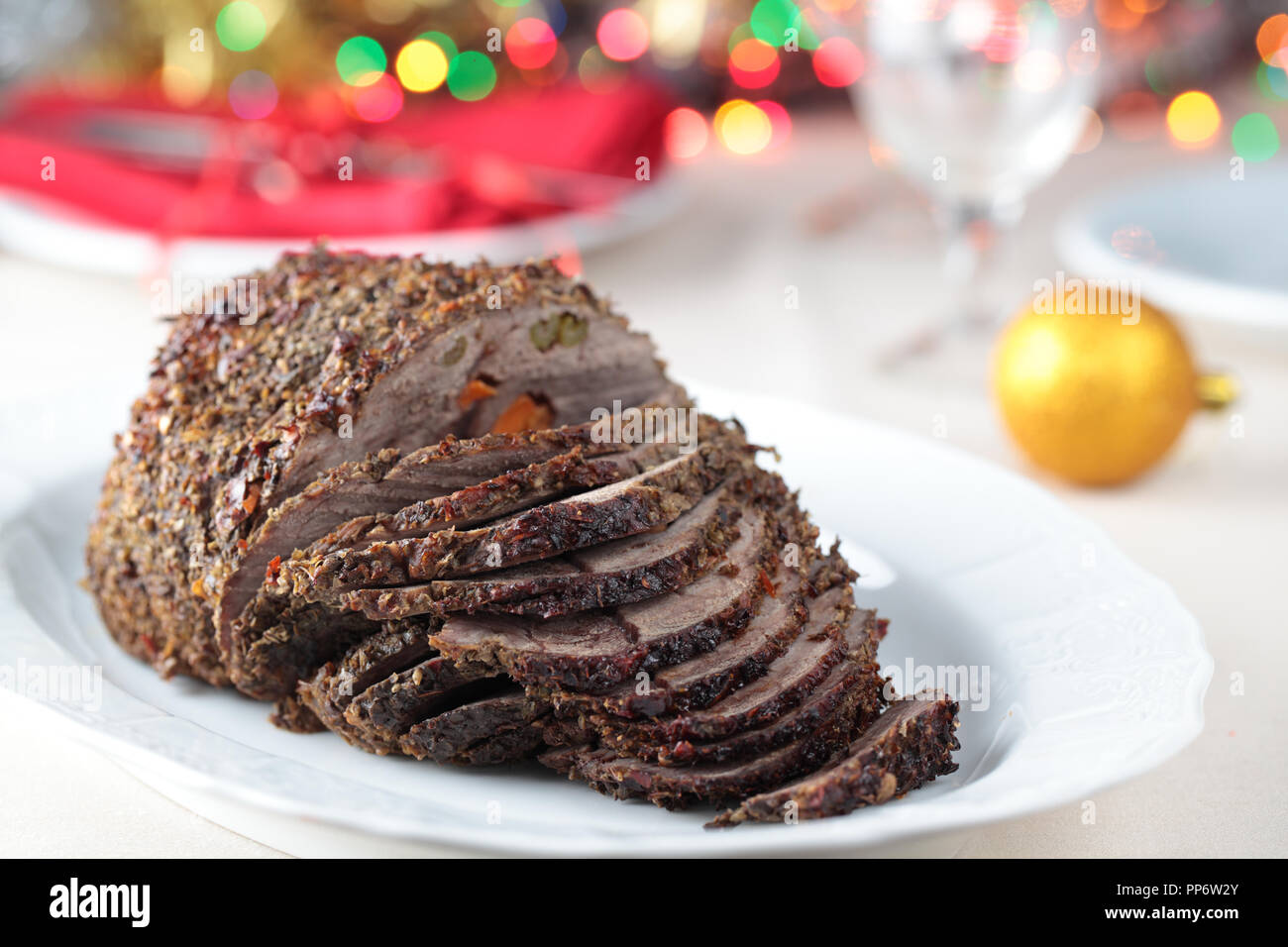 Larded roast beef on the Christmas table Stock Photo