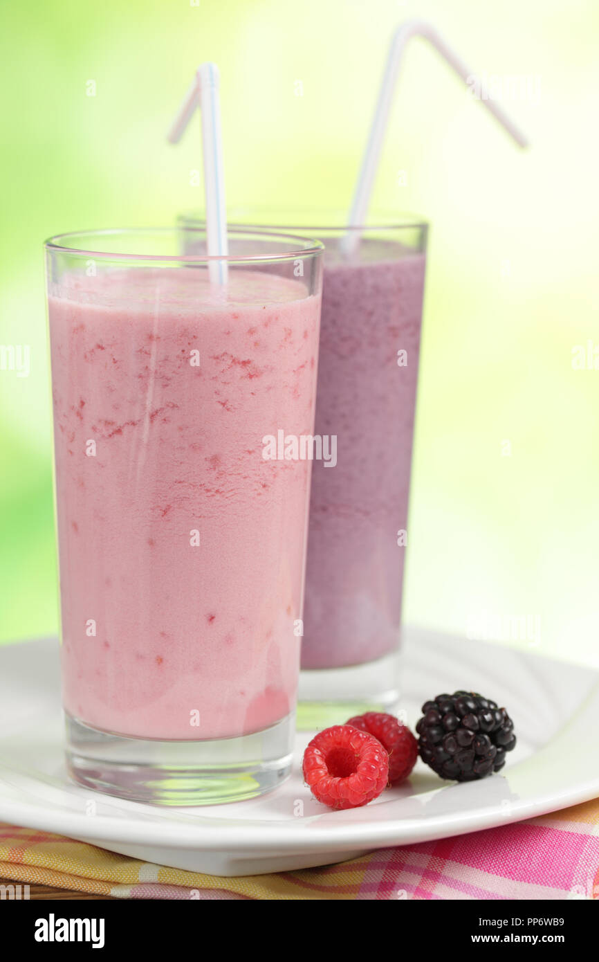 Raspberry and blackberry smoothies in cocktail glasses Stock Photo Alamy