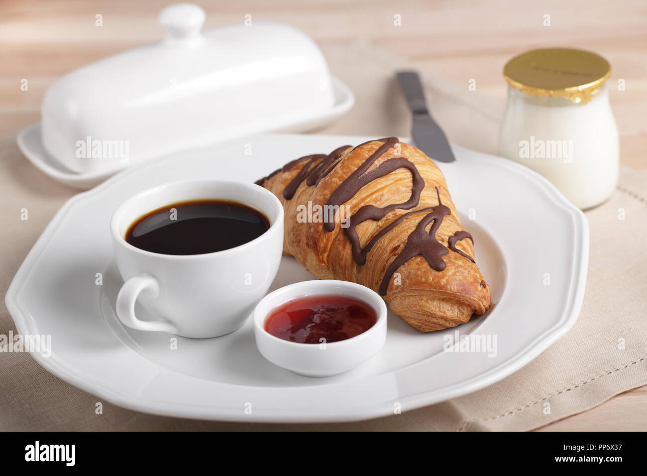 Croissant and a cup of tea French breakfast, Stock image