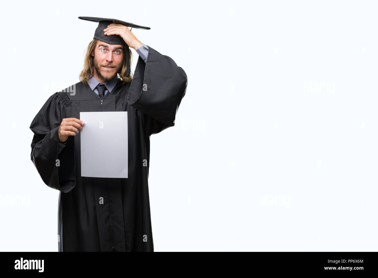 Young handsome graduate man with long hair holding blank paper over ...