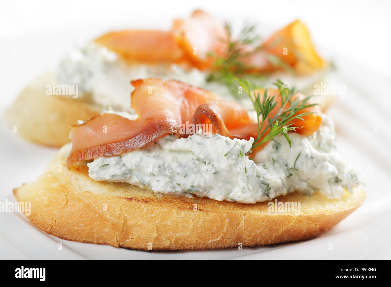 Bruschetta with soft cheese and smoked salmon Stock Photo
