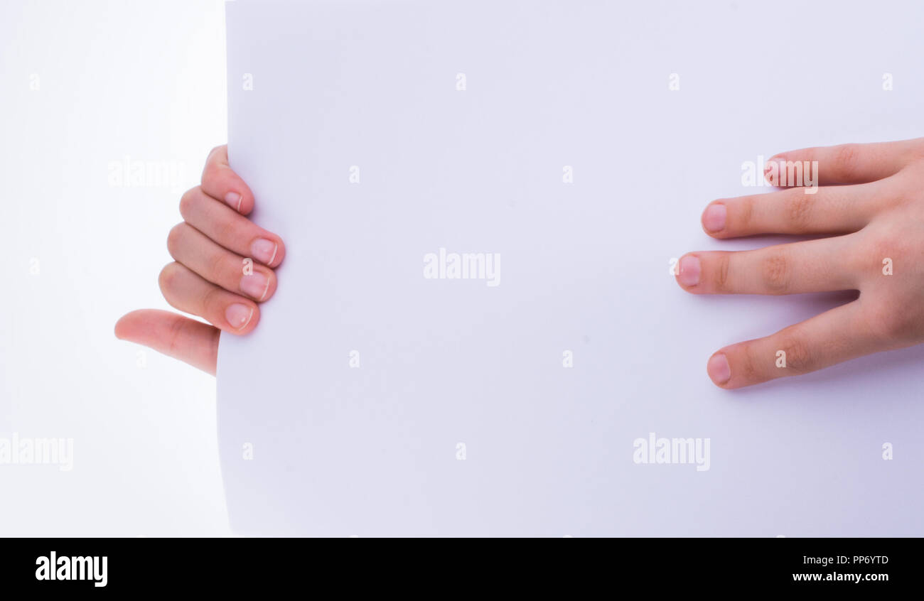 Hand holding a white blank sheet of paper on a white background Stock ...