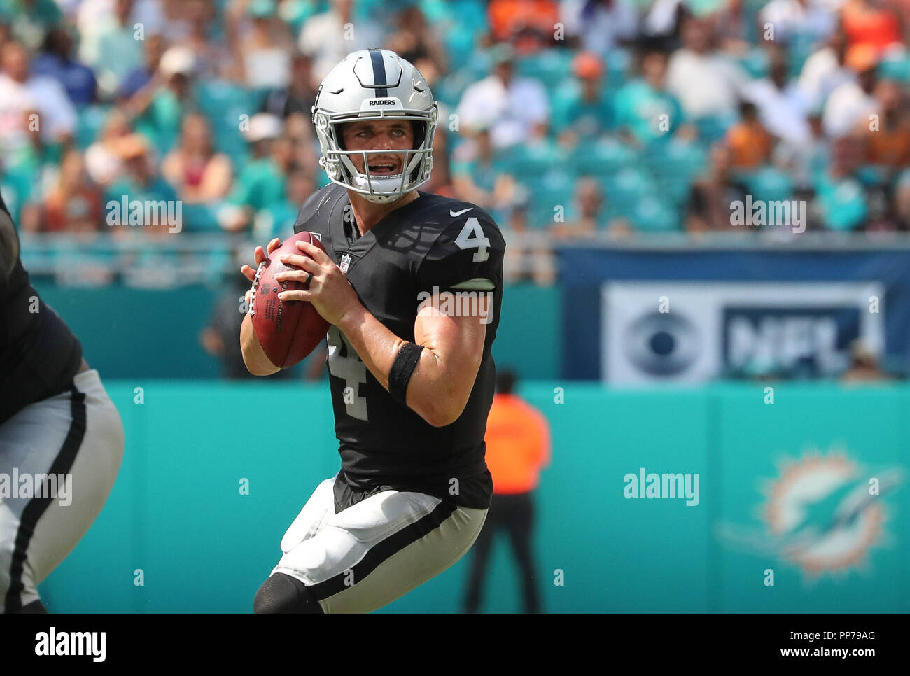 Miami Gardens, Florida, USA. 23rd Sep, 2018. Oakland Raiders quarterback Derek Carr (4) in action during a NFL football game between the Oakland Raiders and the Miami Dolphins at the Hard Rock Stadium in Miami Gardens, Florida. Credit: Mario Houben/ZUMA Wire/Alamy Live News Stock Photo