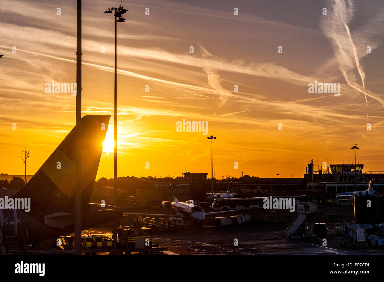 Bristol Airport, UK weather. 24th September 2018. The sun rises over the airport at the start of a fine sunny day. Credit: Richard Wayman/Alamy Live News Stock Photo