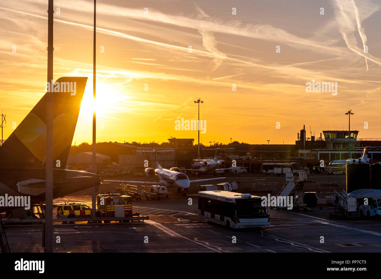 Bristol Airport, UK weather. 24th September 2018. The sun rises over the airport at the start of a fine sunny day. Credit: Richard Wayman/Alamy Live News Stock Photo