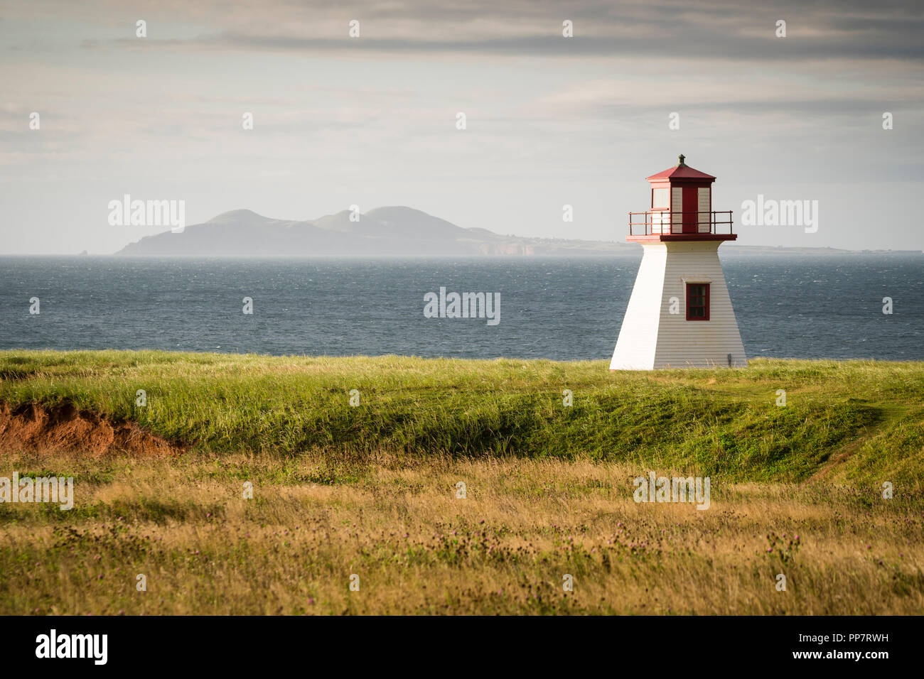 Sunrise view of lighthouse at Cap Alright overlooking Anse Firmin in ...