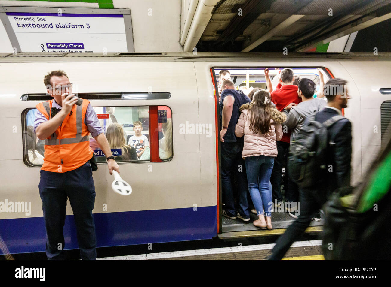 London England,UK,Piccadilly Circus Underground Station train Tube subway tube,public transportation mass transit,inside interior,platform conductor,t Stock Photo