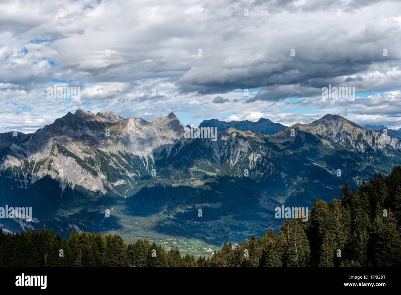 Mountain Landscape In The Swiss Alps Above Maienfeld With Many Peaks And Forests And Valleys Below In Early Autumn Stock Photo Alamy