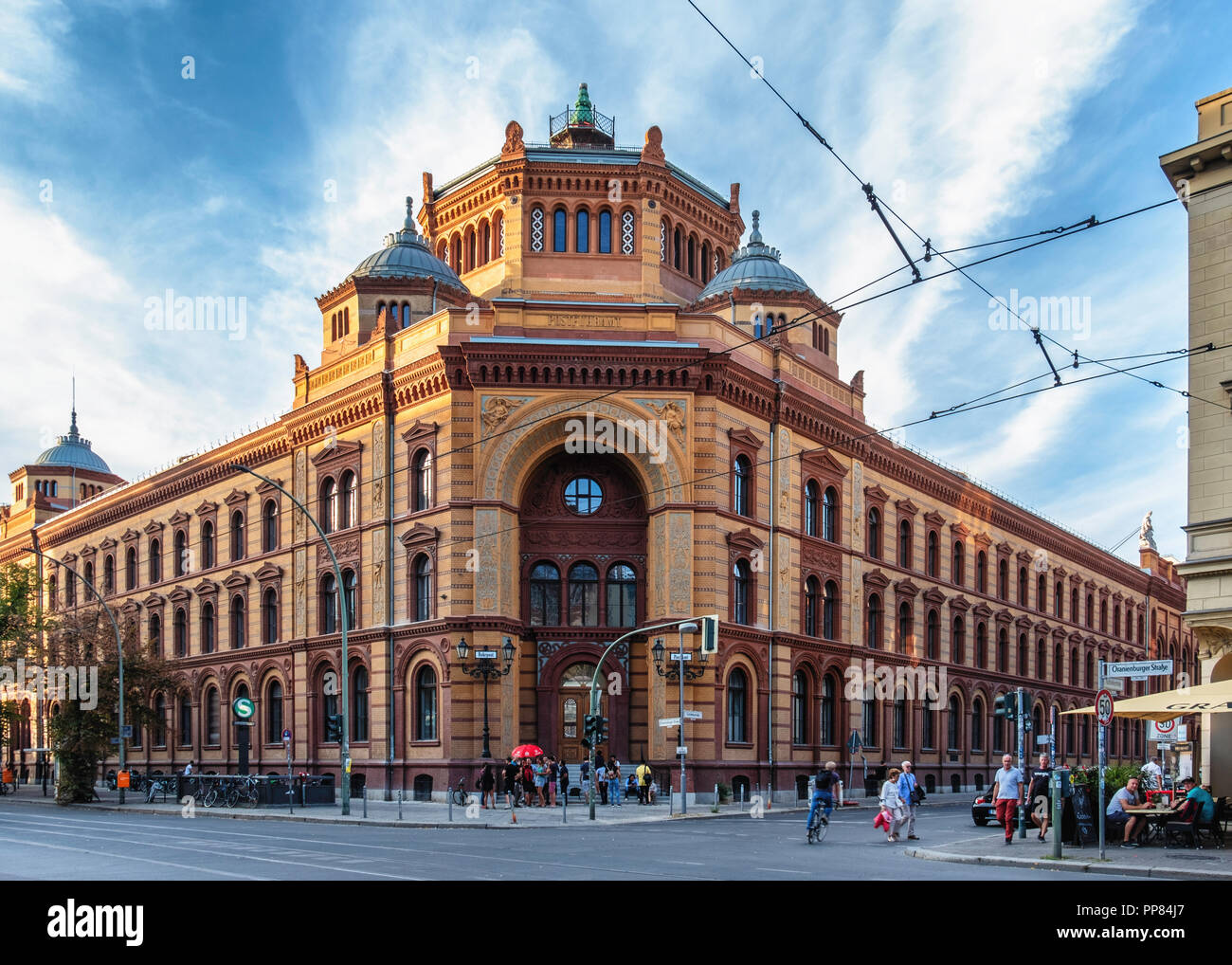 Berlin-Mitte. Historic listed old Post Office building with brick exterior, octagonal tower,two green domes and decorative arched entrance Stock Photo