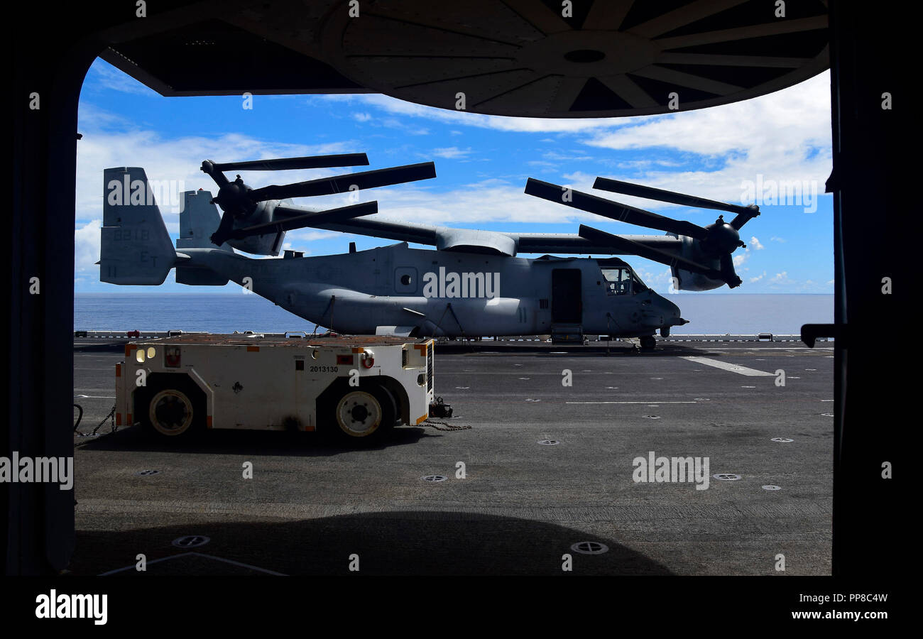 180923-N-RI884-0372 SOUTH CHINA SEA (Sept. 23, 2018) - An MV-22B Osprey tiltrotor aircraft assigned to the “Flying Tigers” of Marine Medium Tiltrotor Squadron (VMM) 262, reinforced, is secured to the flight deck of the amphibious assault ship USS Wasp (LHD 1). Wasp, flagship of the Wasp Amphibious Ready Group, with embarked 31st Marine Expeditionary Unit, is operating in the Indo-Pacific region to enhance interoperability with partners and serve as a ready-response force for any type of contingency. (U.S. Navy photo by Mass Communication Specialist 1st Class Daniel Barker) Stock Photo