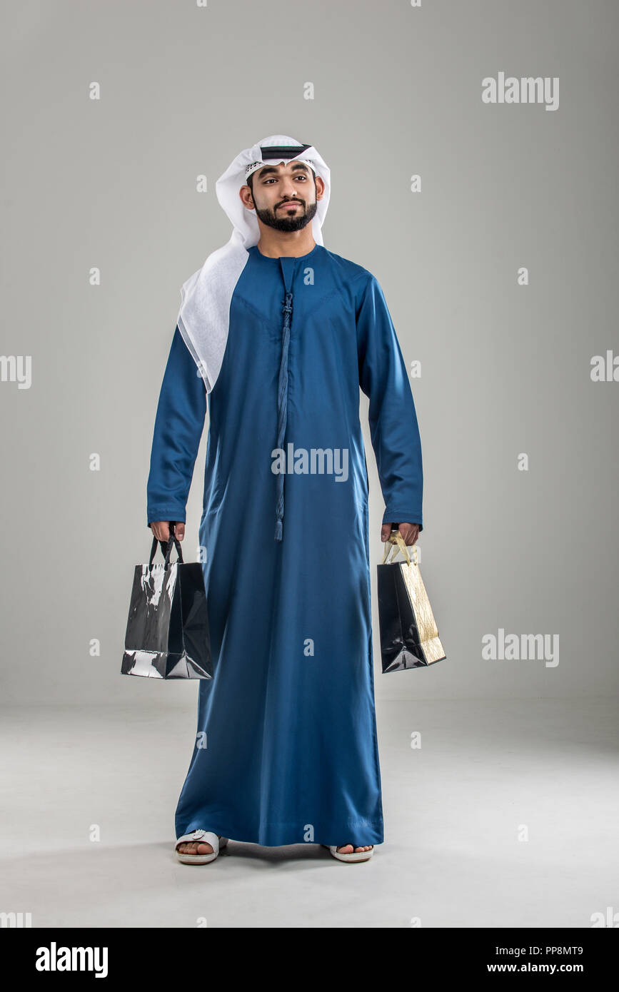 Portrait of arabic man with kandora in a studio Stock Photo - Alamy