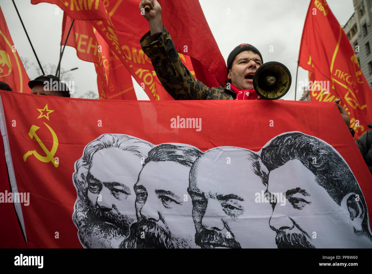 Supporters of the Communist Party of the Russian Federation (CPRF) from different countries march through central Moscow in Russia on November 7, 2017 Stock Photo