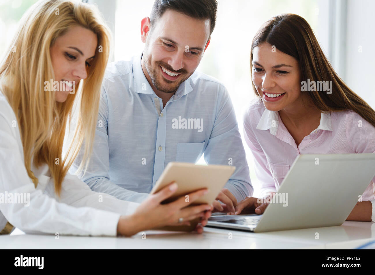 Business colleagues working together at office Stock Photo - Alamy