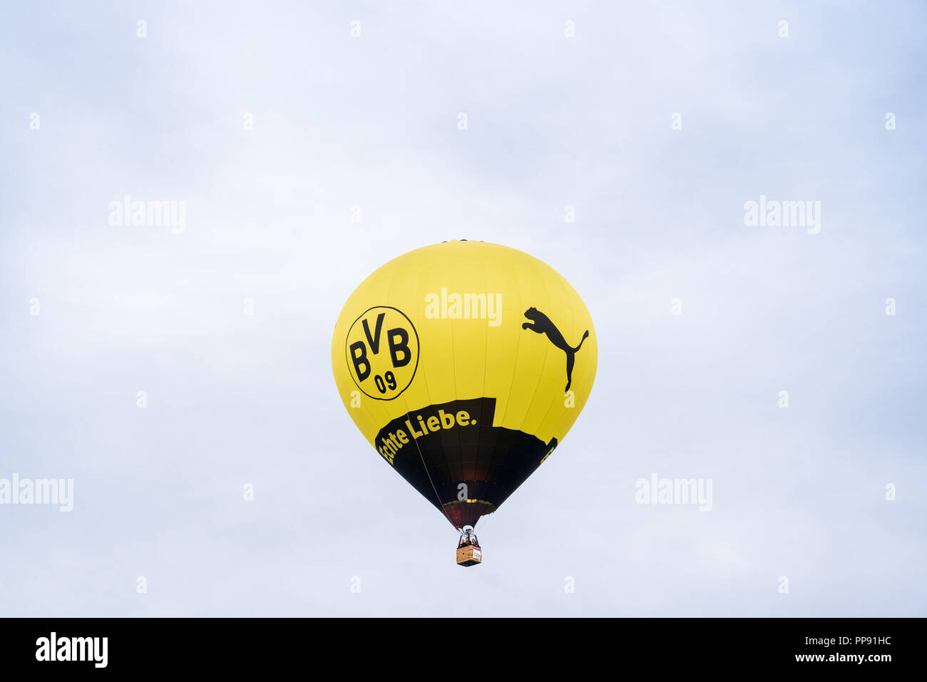Hot air balloon advertising German soccer club BVB and Puma at the 28th Warsteiner Internationale Montgolfiade, 2018 in Warstein, Germany Stock Photo