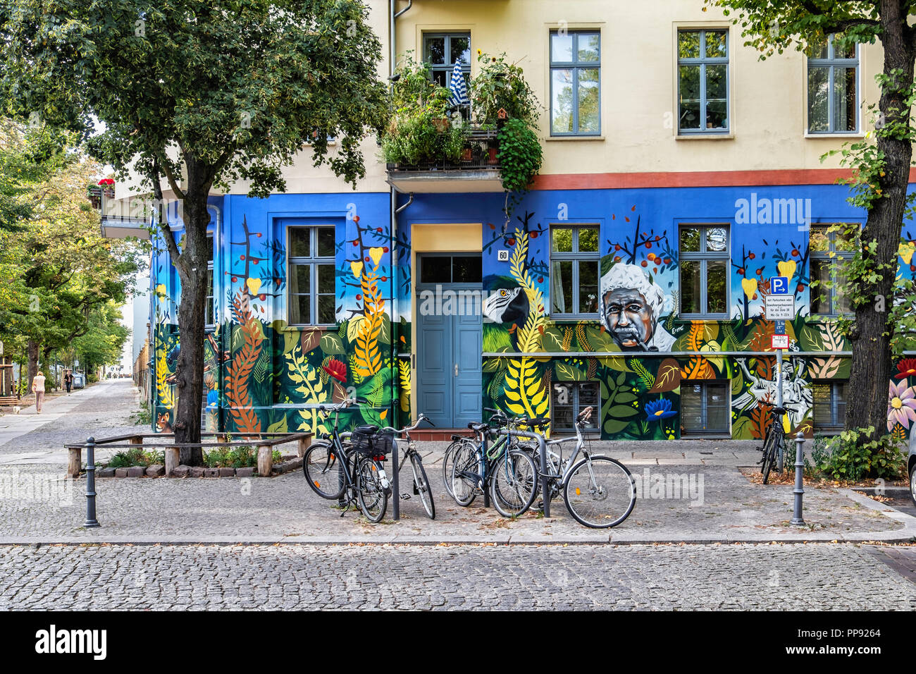 Berlin, Mitte, Anklamer strasse 60. Decorative exterior of apartment building. Painting of flowers,famous men, and animals Stock Photo