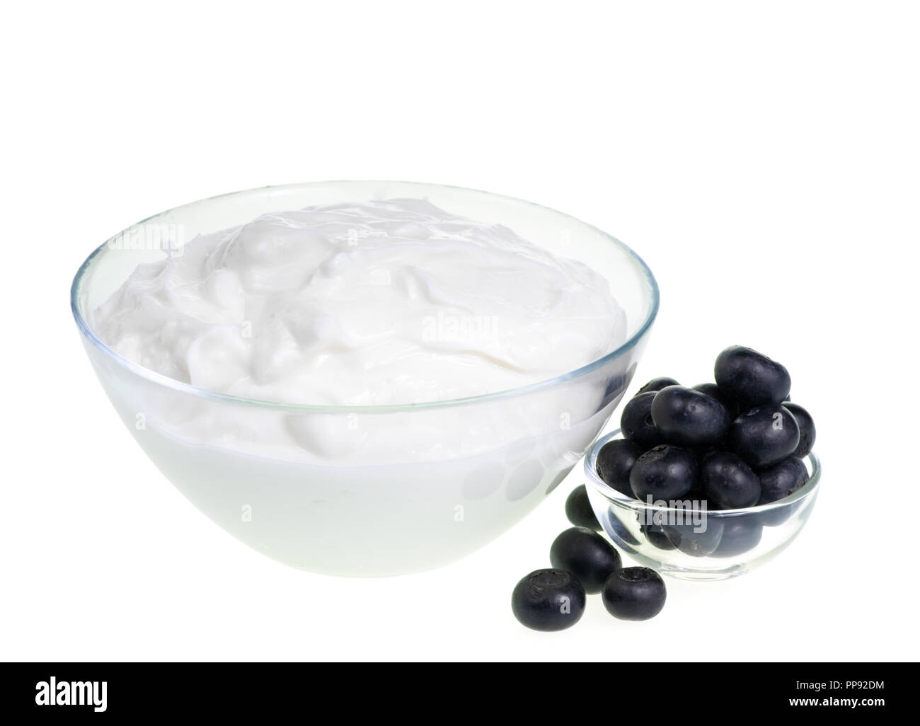 Yogurt bowl and Blueberries on white background Stock Photo