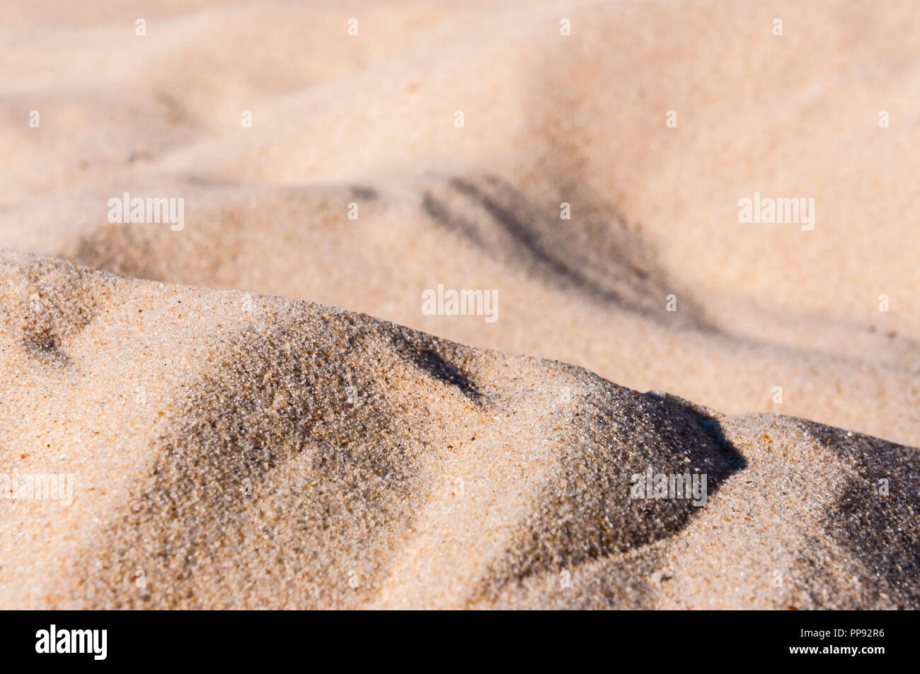 Sand is a naturally occurring granular material composed of finely 