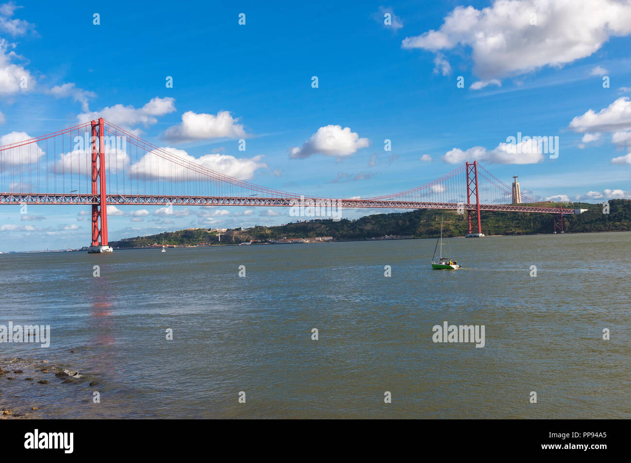 25 April Bridge, former Salazar bridge, over the Tagus river and Cristo ...