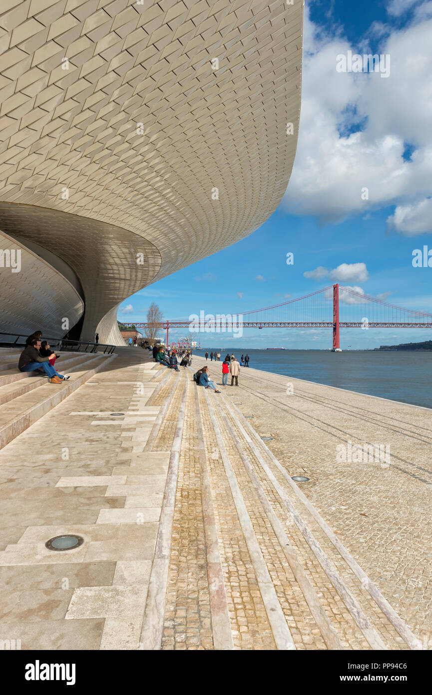 25 April Bridge, former Salazar bridge, over the Tagus river viewed from the MAAT – Museum of Art, Architecture and Technology, Lisbon, Portugal Stock Photo