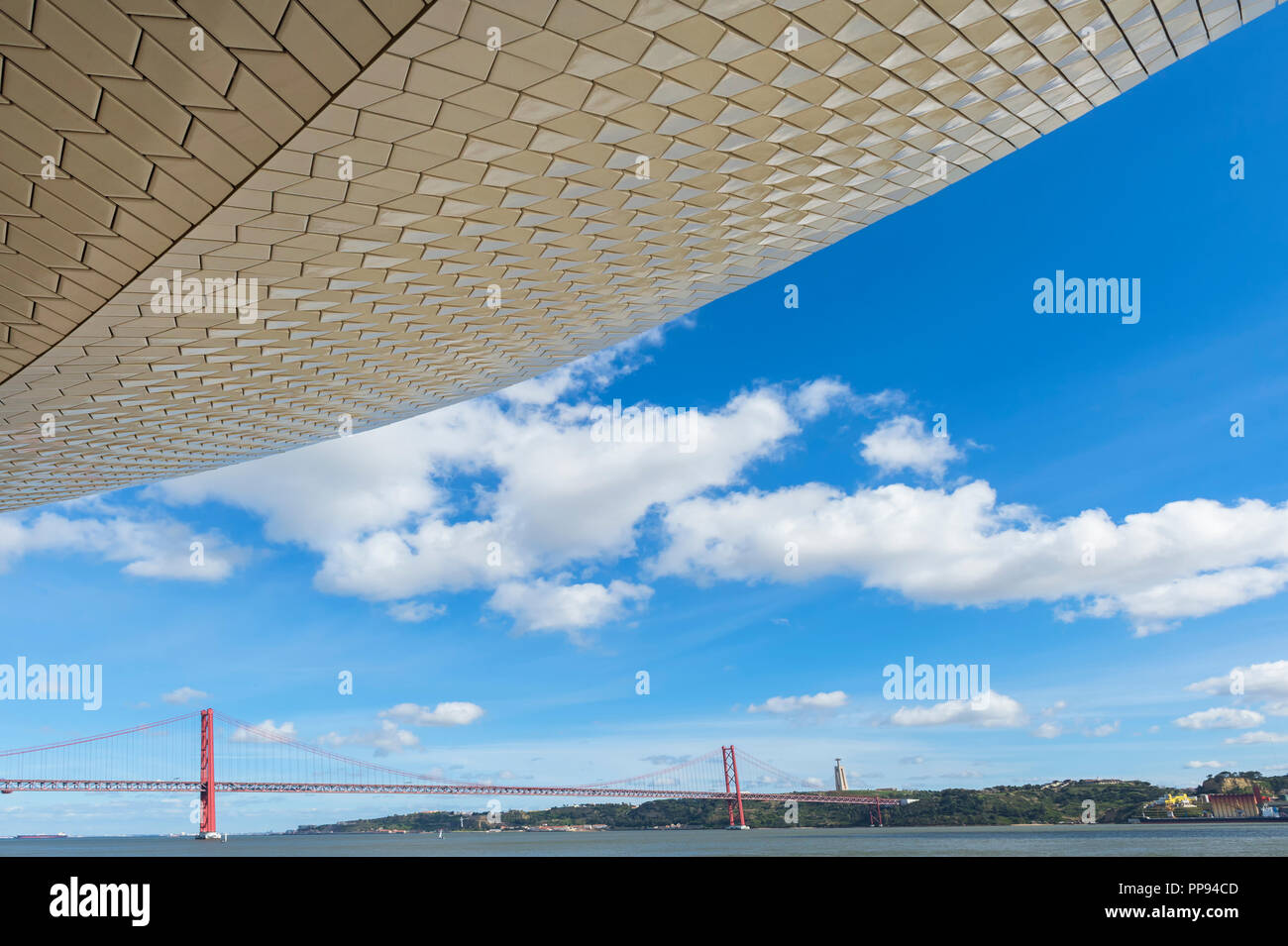 25 April Bridge, former Salazar bridge, over the Tagus river viewed from the MAAT – Museum of Art, Architecture and Technology, Lisbon, Portugal Stock Photo