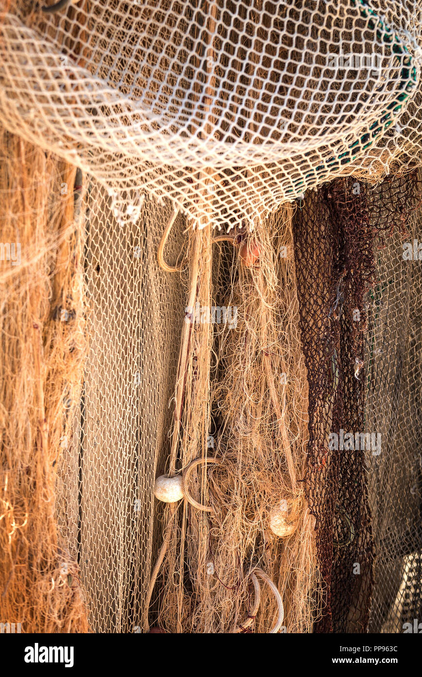 Old fishing net in the harbor with cork floats Stock Photo - Alamy