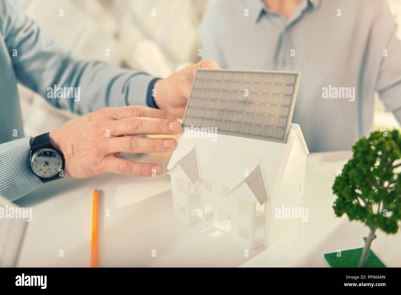 Close up of male hands that demonstrating model of house Stock Photo ...