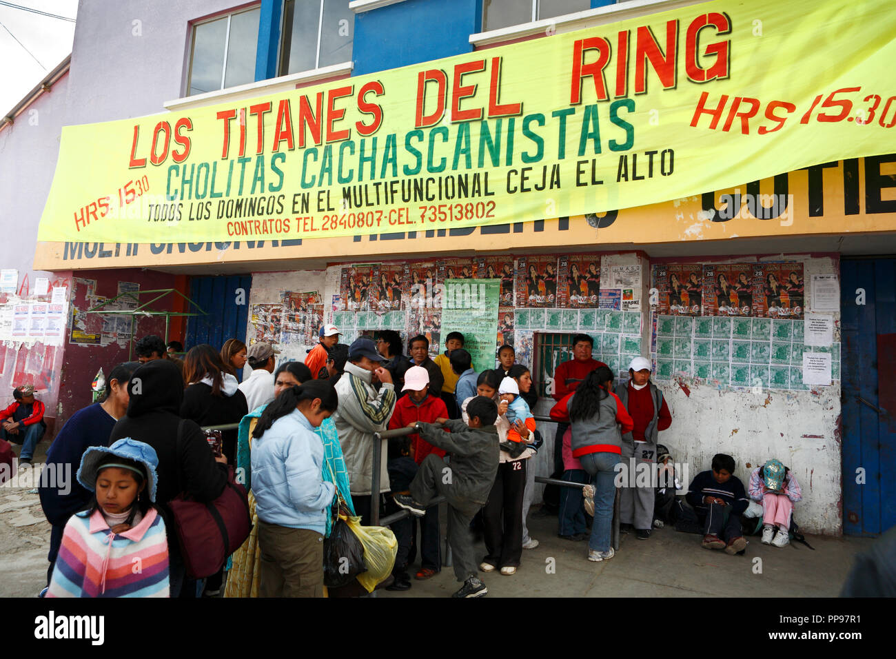 Waiting spectators in front of the multi-purpose sports hall Anden Secrets at the Plaza San Pedro in El Alto, above Bolivia's capital La Paz, where on every Sunday afternoon the Catching takes place with the main absorption the Cholitas wrestling. Stock Photo