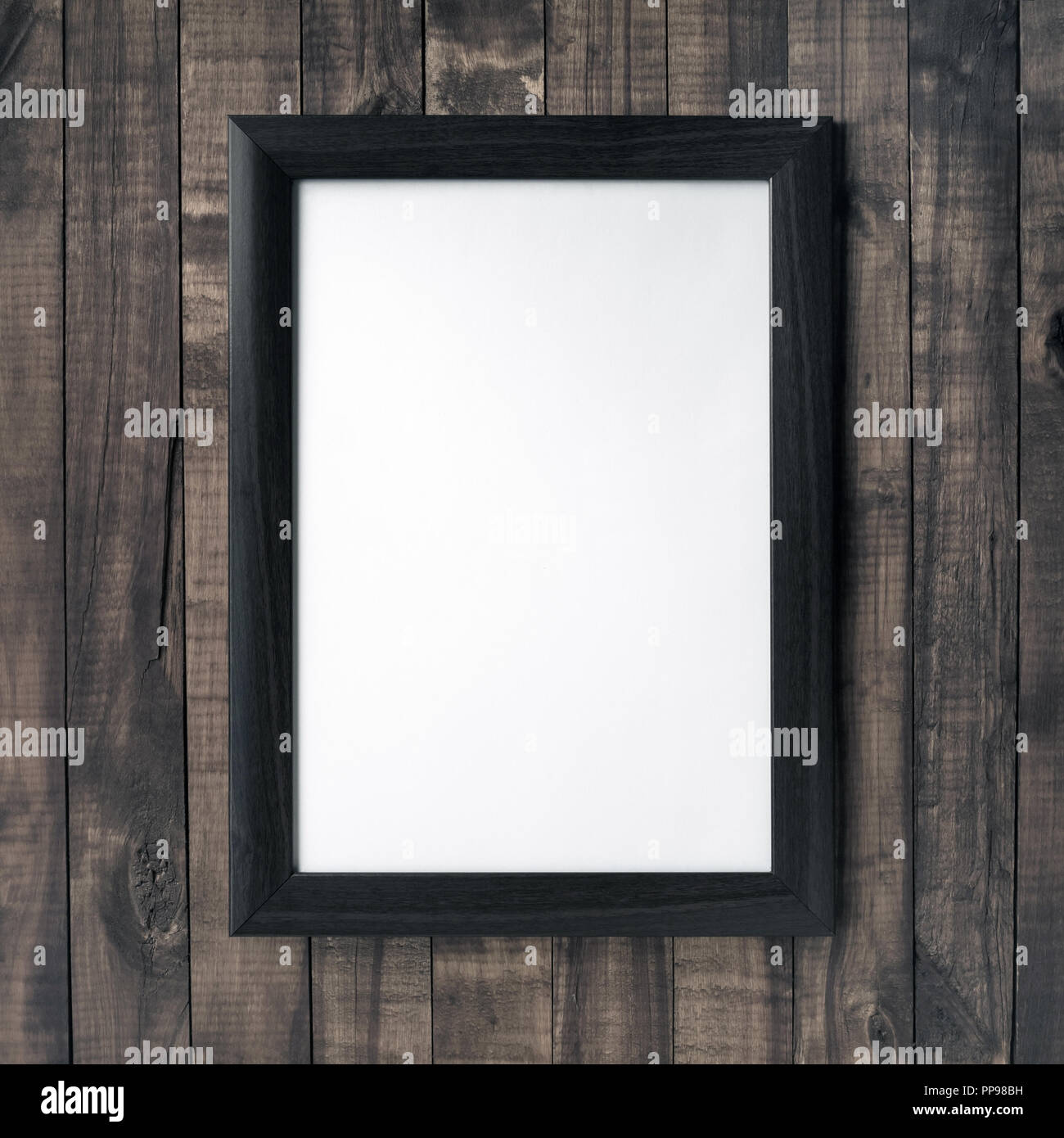 Frame for photo on wooden background. Responsive design mockup Stock