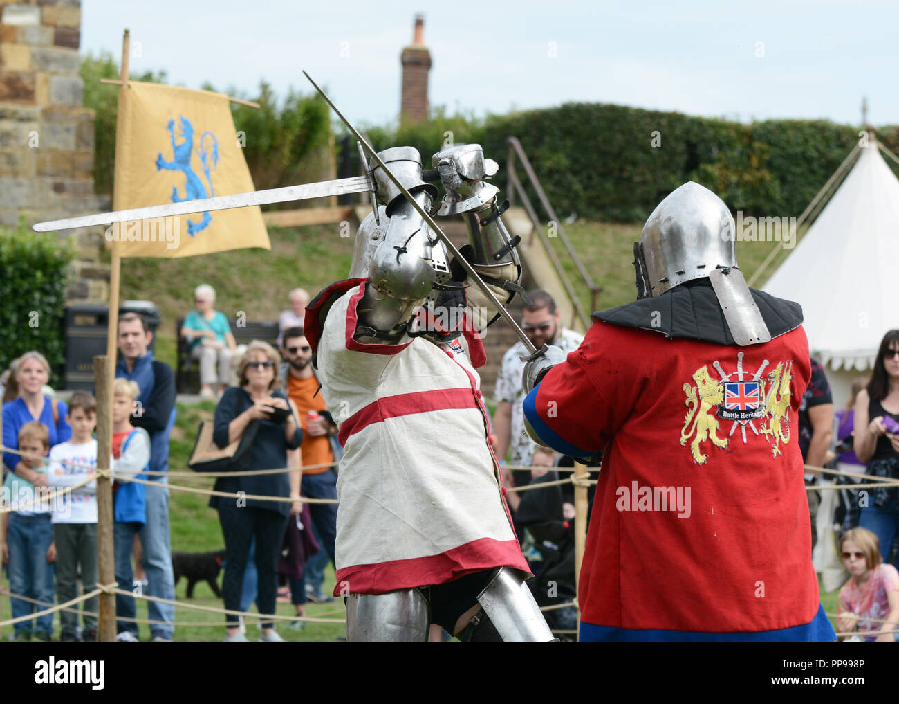 TONBRIDGE, ENGLAND - SEPTEMBER 9, 2018: Two knights in medieval battle dress fight with swords at the Medieval Fair at Tonbridge Castle Stock Photo