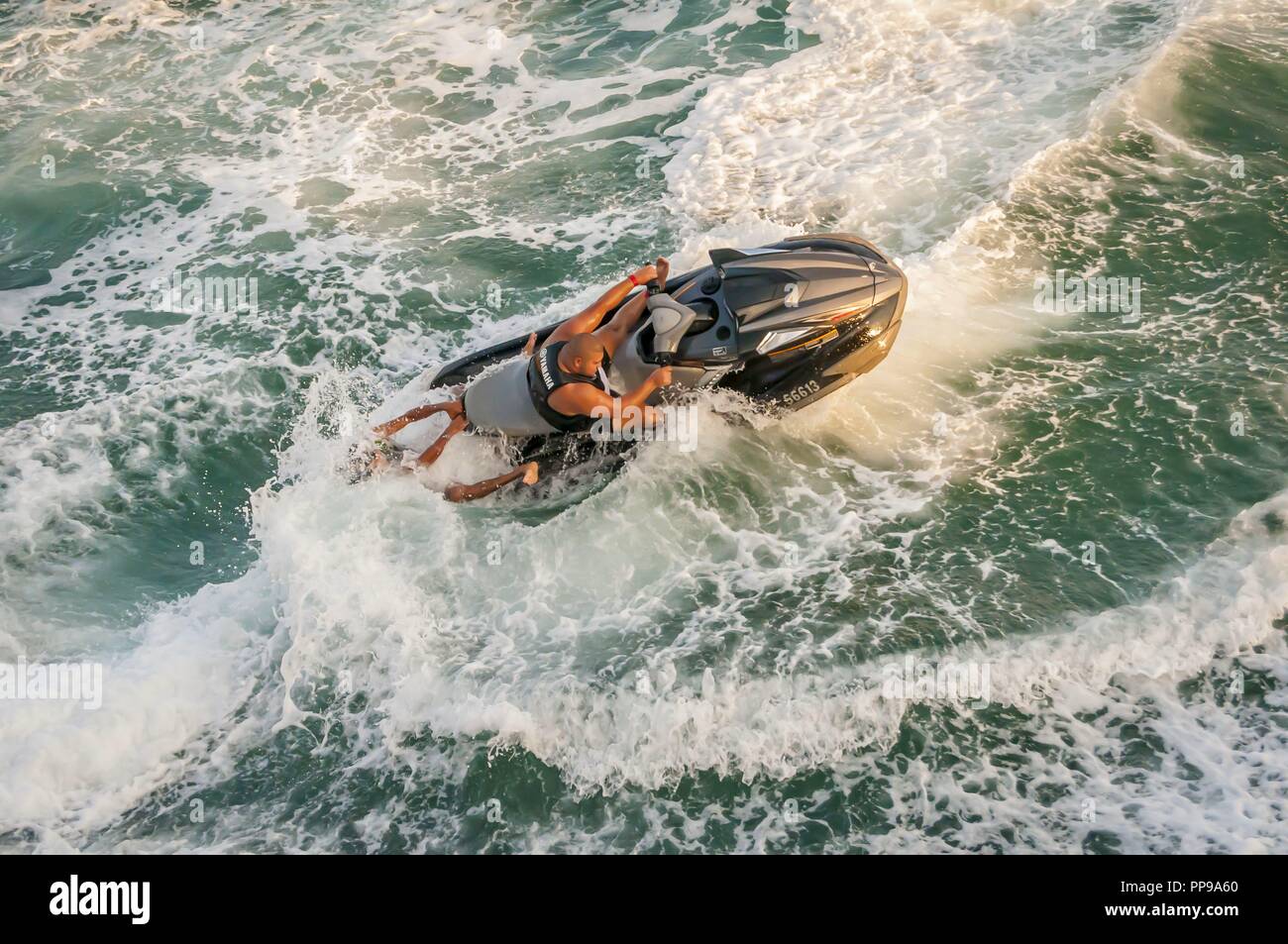 Old man driving boat hi-res stock photography and images - Alamy