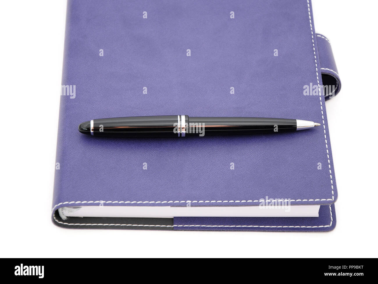 ballpoint pen is laying on the notebook Stock Photo