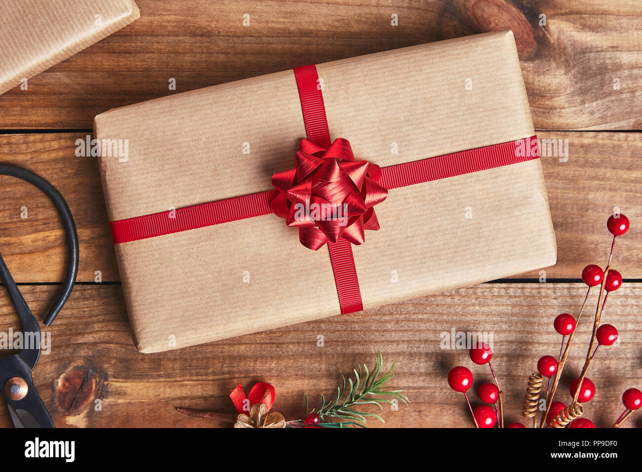 Christmas present on rustic wooden background. Flat lay Stock Photo