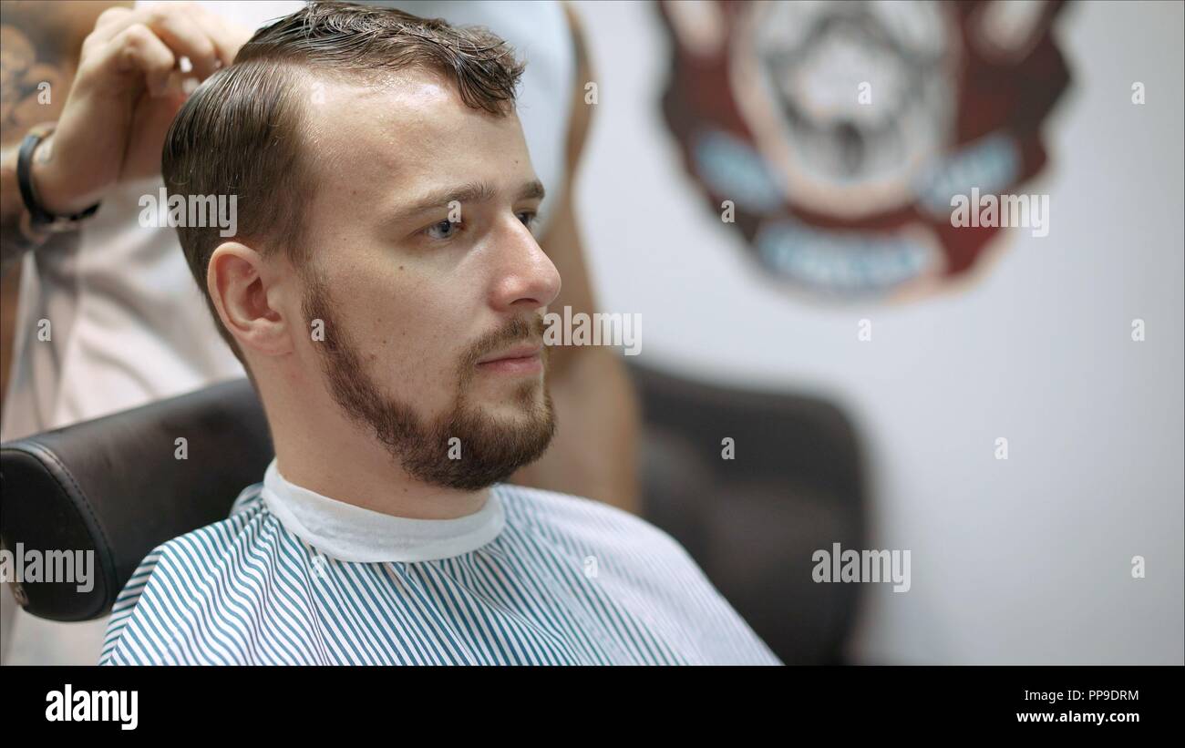 Men S Haircut In Barbershop Master Barber Does A Haircut To The